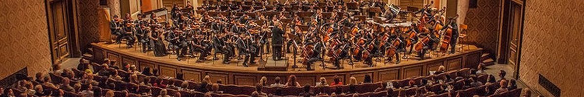 A large concert hall featuring an imposing organ