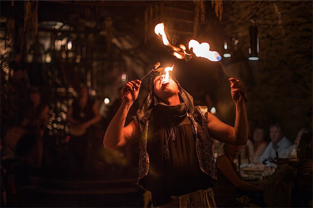 A man breathing fire