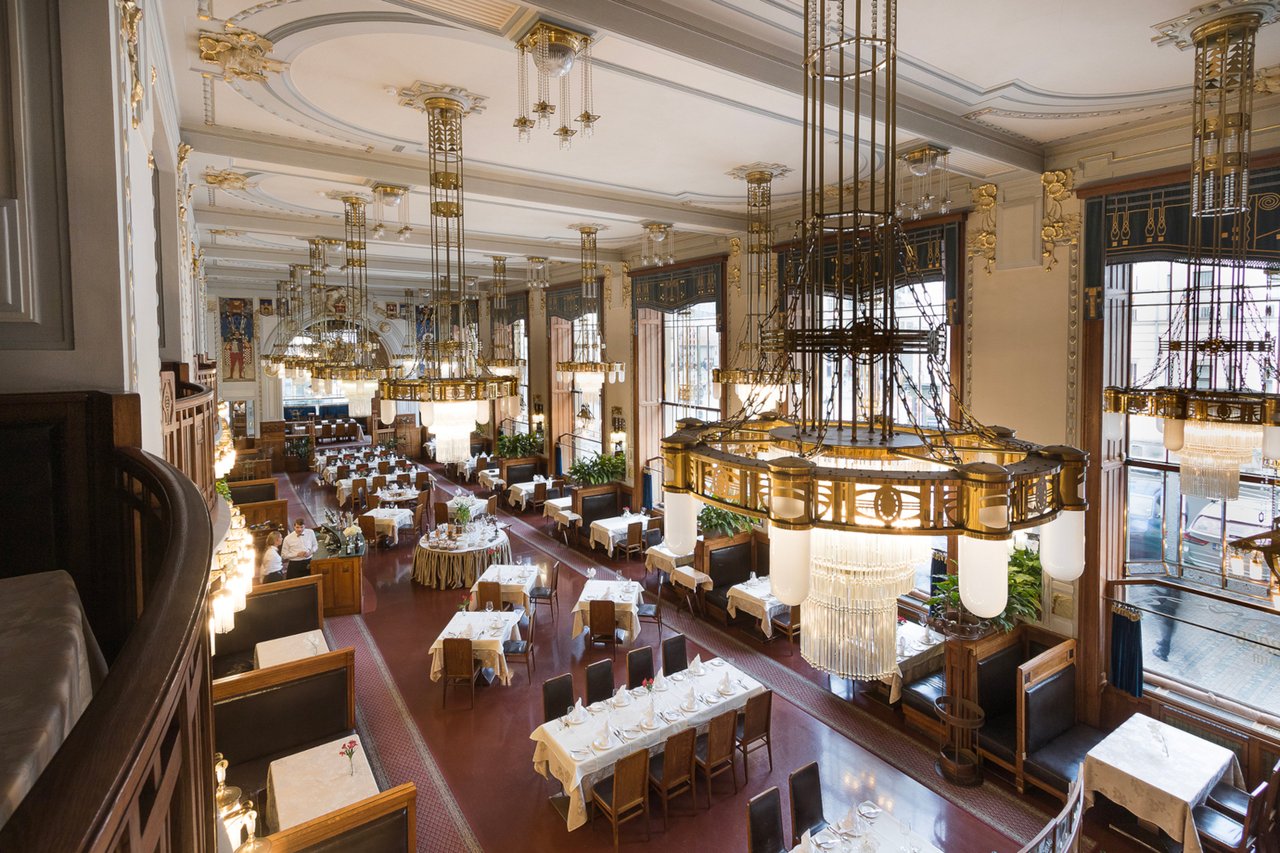 Large dining room with many chandeliers