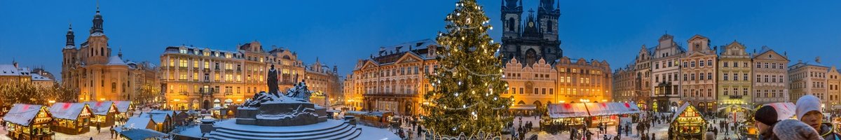 A large Christmas market with a big decorated Christmas tree in the center
